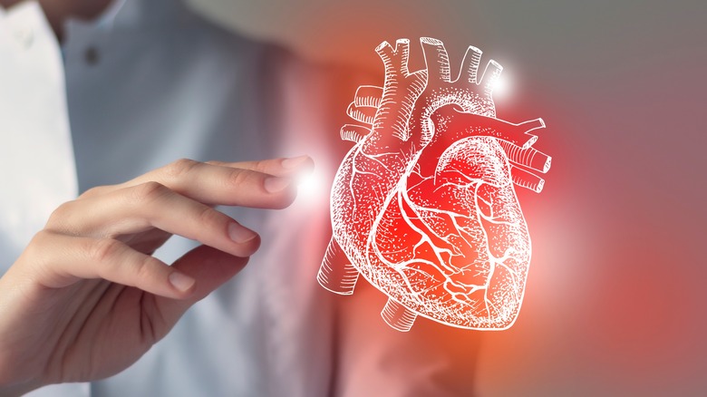 Female,Doctor,Touchstone,Virtual,Heart,In,Hand.,Blurred,Photo,,Handrawn