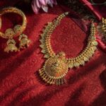 exquisite-gold-jewelry-displayed-red-fabric_808279-60