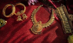 exquisite-gold-jewelry-displayed-red-fabric_808279-60
